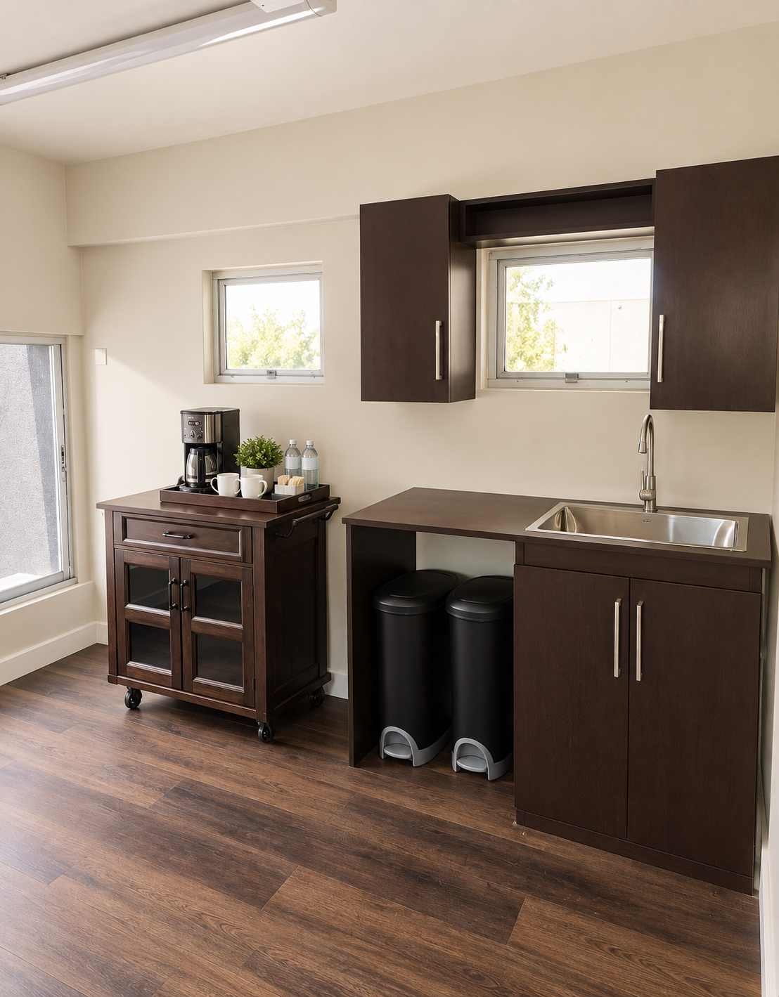 Clean executive kitchenette and guest refreshment station
